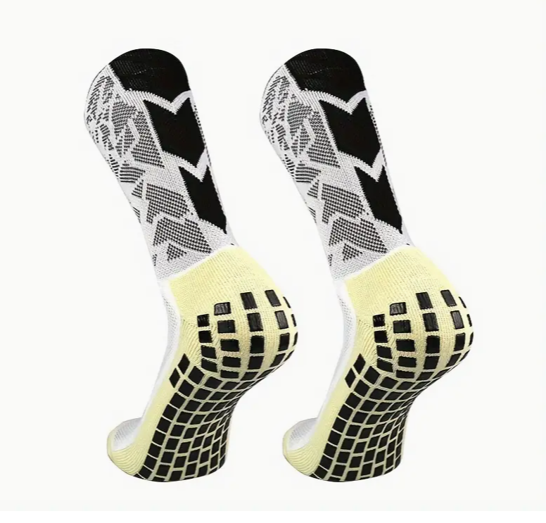 Fotballsokker, med sklisikker silikon. Sokker med spesifikk kompresjon på fotbuen, som gir utmerket støtte og stabilitet. Laget med pustende nylon elastan. Justerbar fra nummer 38 til 45.
